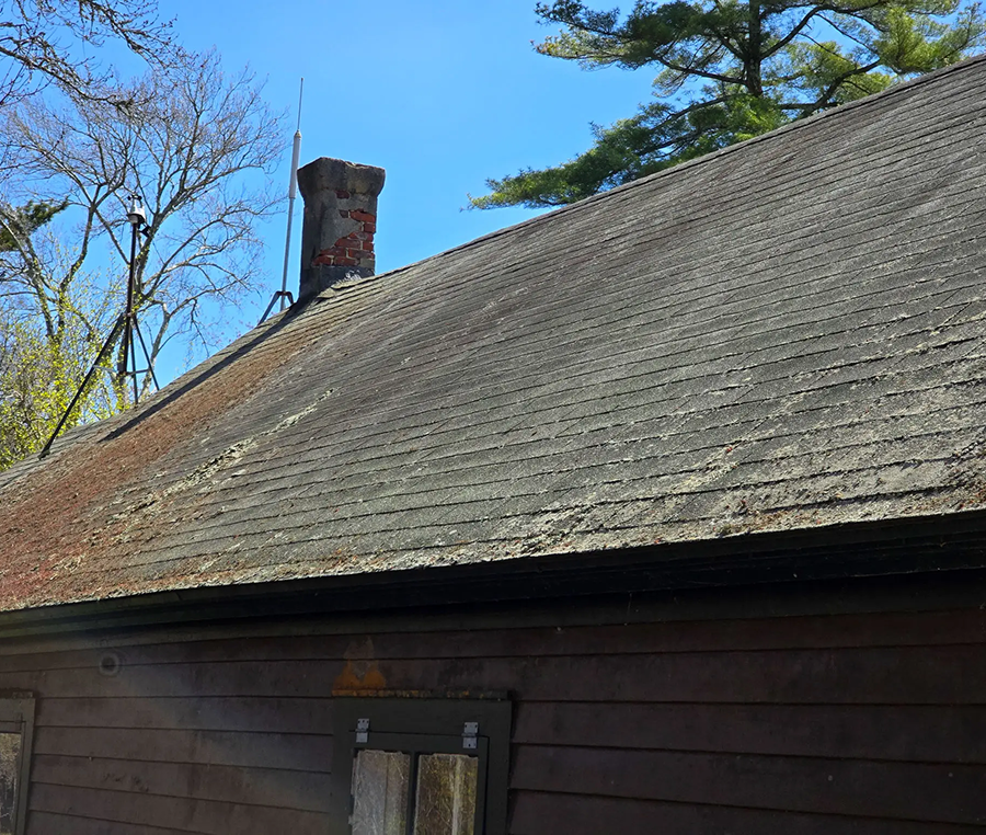Rustic roof under clear blue sky
